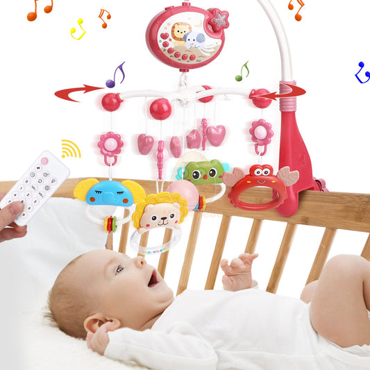 bébé au lit émerveillé par mobile musicale bebe