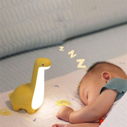 bébé dort avec veilleuse bebe dinosaure jaune