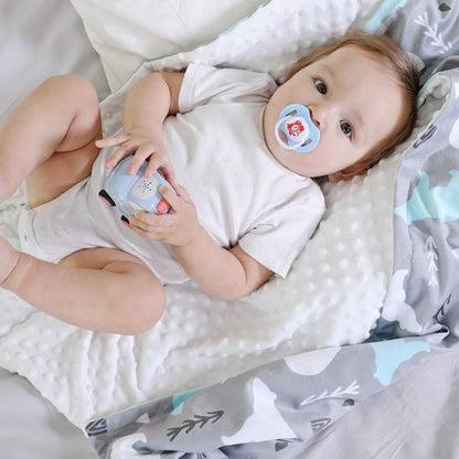 bébé sur couverture bébé deux faces ours