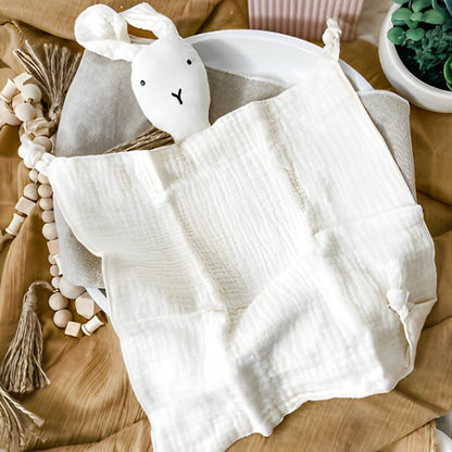 joli doudou bebe lapin blanc allongé