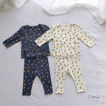 
un pyjama bébé fille gris autre beige fruites